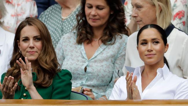 Kate Middleton and Meghan Markle (Photo by Ben Curtis / POOL / AFP)