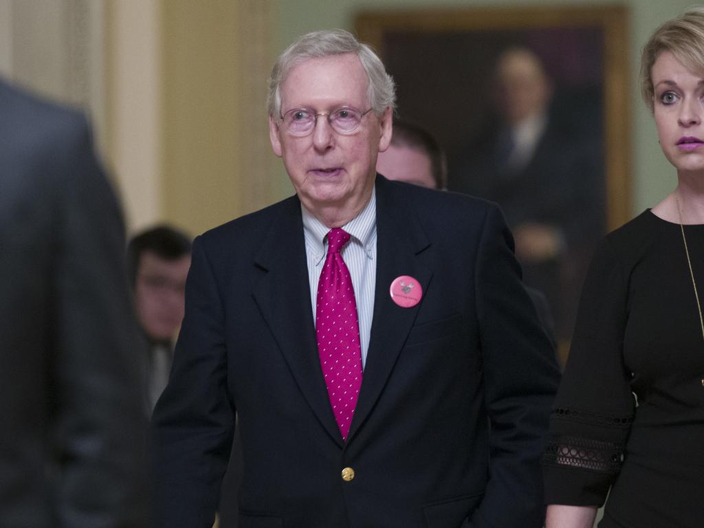 Senate Majority Leader Mitch McConnell walks back to his office as they work to pass a bill to pay for a border wall and avert a partial government shutdown. Picture: AP