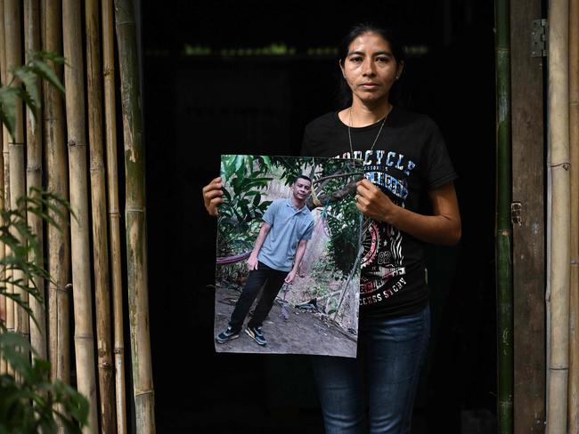 Sandra Hernandez with a picture of her husband Jose Dimas Medrano. Picture: AFP