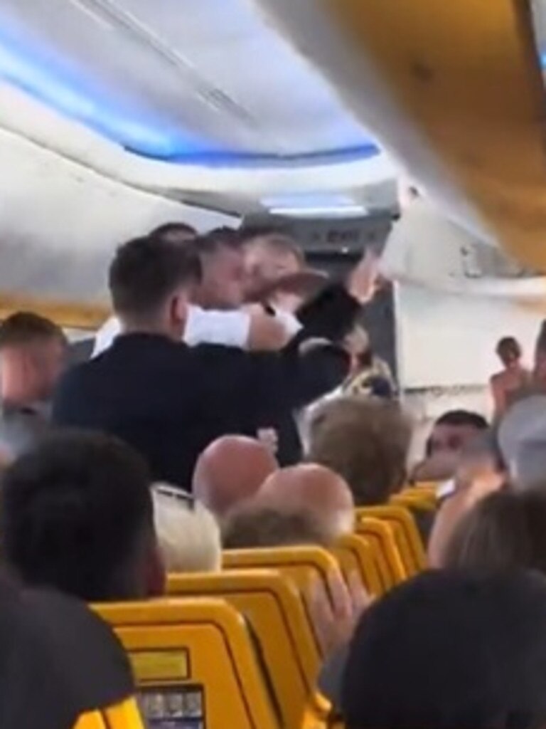 He then slaps a male flight attendant across the face in front of stunned passengers. Picture: Facebook/Canal 4 Tenerife