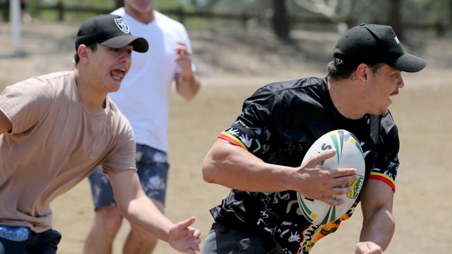 Roberts playing touch with Macleay Vocational College students. Picture: Nathan Edwards