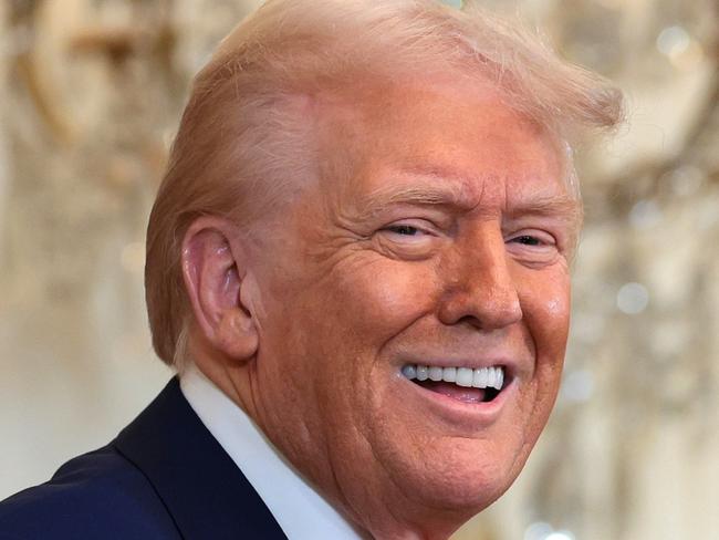 WASHINGTON, DC - FEBRUARY 20: U.S. President Donald Trump, joined by golf legend Tiger Woods, speaks during a reception honoring Black History Month in the East Room of the White House on February 20, 2025 in Washington, DC. The Black History Month celebration comes as Trump has signed a series of executive orders ending federal diversity, equity, and inclusion (DEI) programs and cutting funding to schools and Universities that do not cut DEI programs. (Photo by Win McNamee/Getty Images)