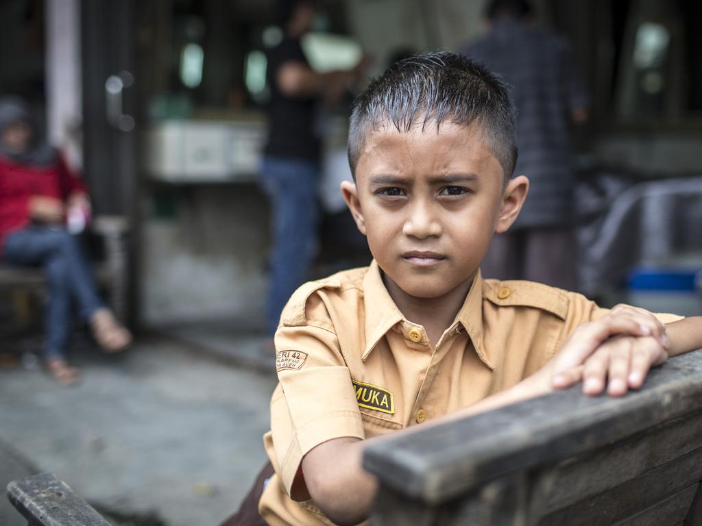 A boy in school uniform in Banda Aceh, Indonesia. Picture by Matt Turner.