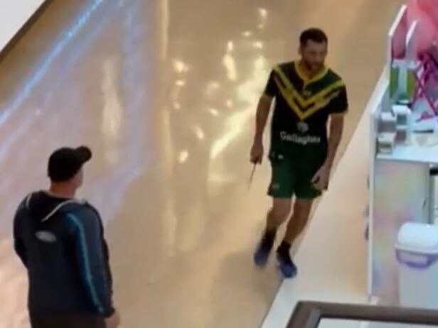 The man walks with knife through Bondi Junction. Picture: 9News