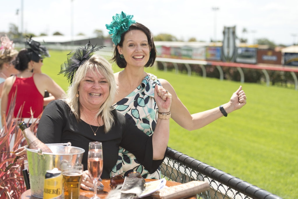 Looking for a strong finish are Michelle Schurmann (left) and Natalie Rummell at Melbourne Cup celebrations at Clifford Park, Tuesday, November 7, 2017. Picture: Kevin Farmer