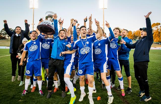 Sydney Olympic players and coaching staff celebrate winning the 2018 NPL premiership. Picture: Football NSW