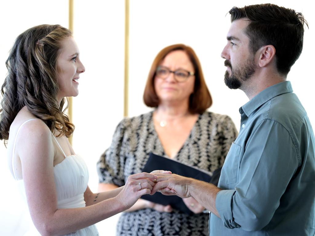 Emily Hill and Ryan Burton say their vows on Tuesday. Picture: Steve Pohlner