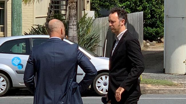 Anthony Bryan Hack (right) leaves Tweed Heads Courthouse on Monday.