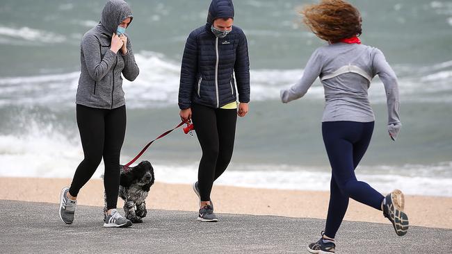 People exercising along Elwood beach in Melbourne. Picture: NCA NewsWire / Ian Currie