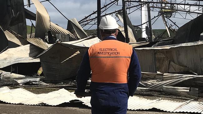 Fire investigators on scene at a burnt shed in Forest which causes $4 million damage to a local construction company. Picture: Helen Kempton.