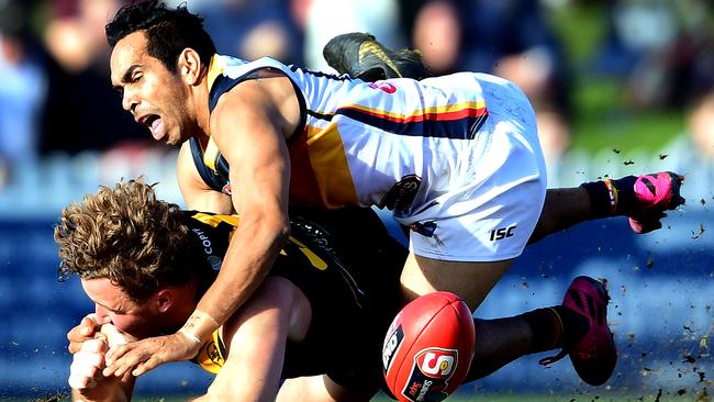 Eddie Betts tackles Will Gould of the Tigers in the last quarter during the round 14 SANFL match between the Glenelg and the Adelaide Crows. Picture: Mark Brake/Getty Images