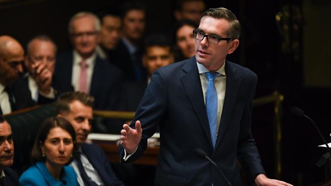 NSW Treasurer Dominic Perrottet hands down last year’s state budget at NSW Parliament House. Picture: AAP/Dean Lewins