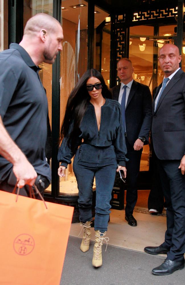 Kim Kardashian accompanied by bodyguard Pascal Duvier as she shops at the Hermes store in Paris on September 30, 2016. Picture: Splash