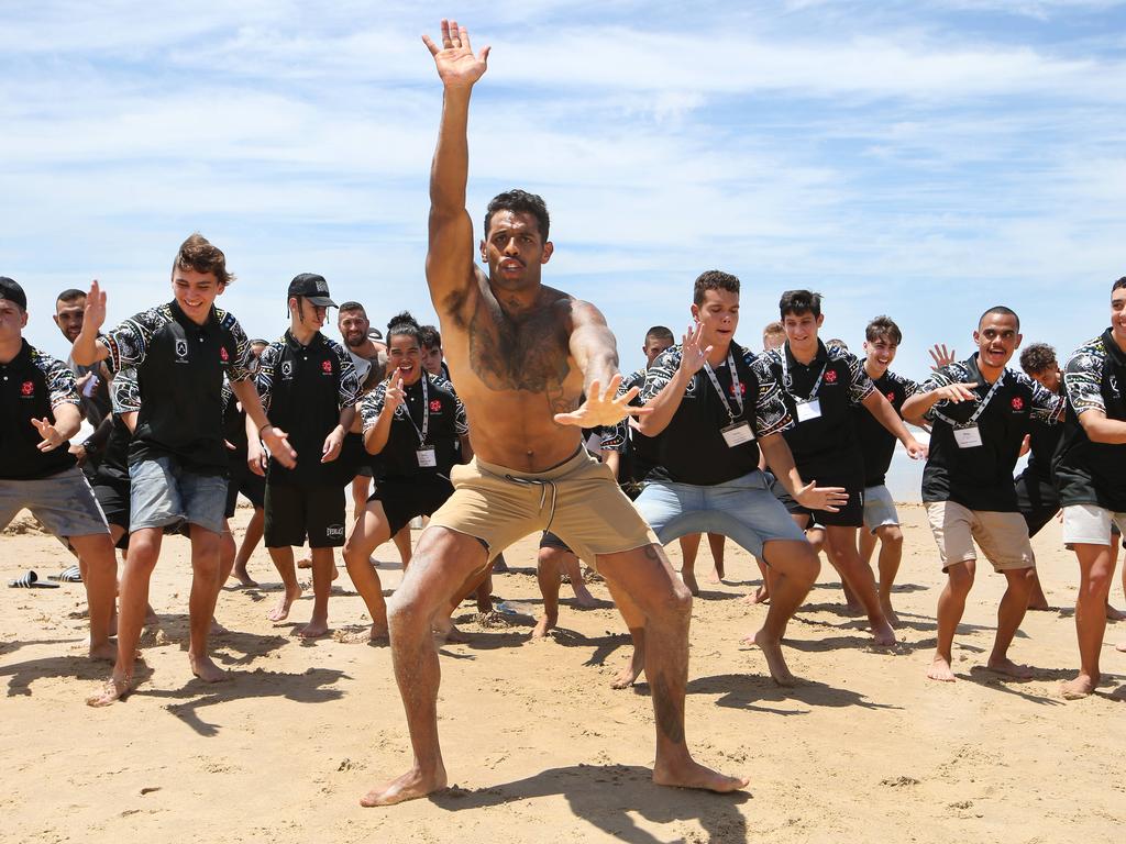 Josh Addo-Carr leads a dance with young Indigenous men at Kurrawa beach last year. Picture: Glenn Hampson