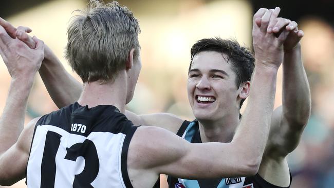 Young guns Connor Rozee and Todd Marshall celebrate against the Dockers. Picture SARAH REED