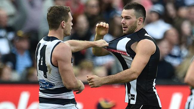Geelong's Joel Selwood was well held by Levi Greenwood as his Cats lost to Collingwood.