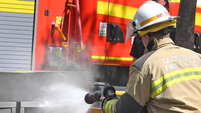 Brisbane, AUSTRALIA - NewsWire Photos September 18, 2020:Fire Fighters put out a fire in a bin in George St Brisbane CBD.  Picture: NewsWire / John Gass