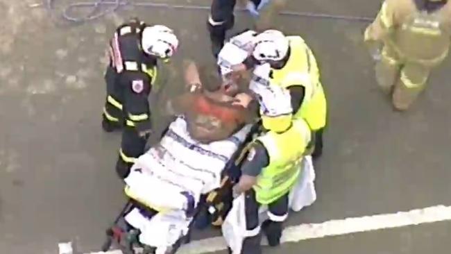 Rescuers have freed a man who was trapped in mud after a trench collapse in Essendon. Picture: Seven News