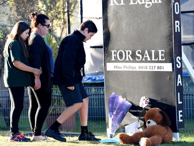 Children arrive before school to lay tributes at the Tootgarook home. Picture: Nicole Garmston