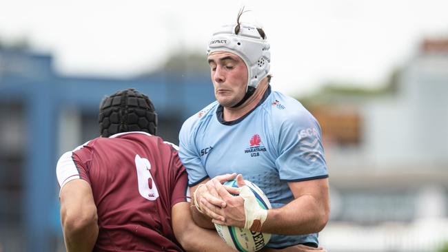 Toby Brial taking on a Queensland Reds rival. Picture: Julian Andrews