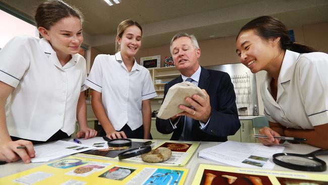 Year 11 students Roisin Bryce-Stark, Leah Flanagan and Karen Su with principal Paul Burgis at Presbyterian Ladies’ College in Sydney yesterday. Picture: John Feder