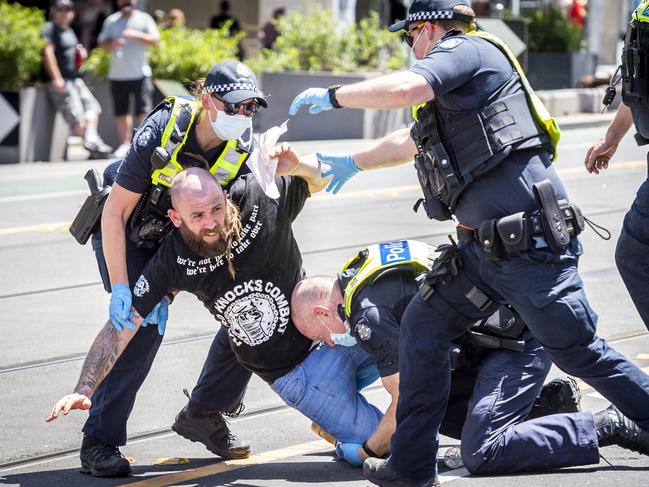 Freedom Day protesters rlly against the Government's Covid-19 restrictions at State Parliament in Melbourne's CBD. Police forcibly arrest protesters. Picture: Jake Nowakowski