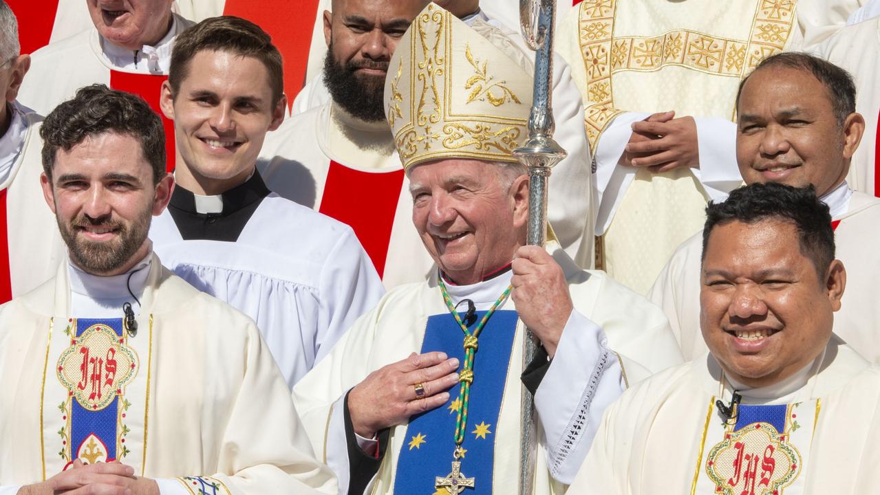 Ordination of Nathan Webb (left) and Brian Redondo (right) with Bishop Robert McGuckin at St Patrick's Cathedral. Deacon Elouie Jiminez (behind Fr Nathan) will be ordained a priest in Brisbane this week. Picture: Nev Madsen.