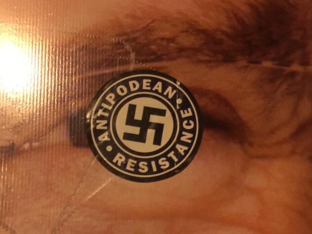 Swastikas have been placed over the eyes of Berowra federal Liberal MP Julian Leeser in a campaign poster at his office in Normanhurst.