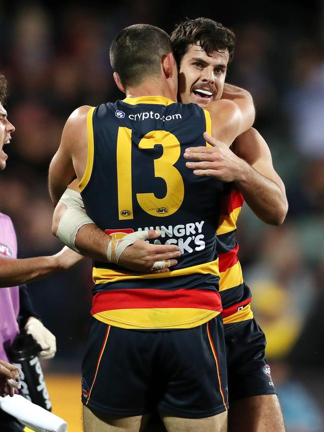 Darcy Fogarty of the Crows celebrates a goal against Cartlon with Taylor Walker at the Adelaide Oval. Picture: Sarah Reed