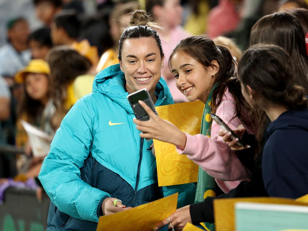 Mackenzie Arnold takes a selfie with a fan after the win against Chinese Taipei in Geelong. Picture: Getty Images