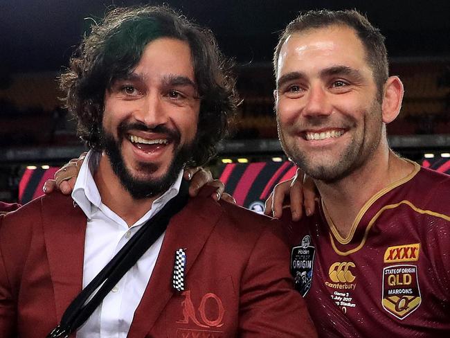 Cooper Cronk, Johnathan Thurston, Cameron Smith and Billy Slater hold the shield up to celebrate winning the Origin decider between Queensland and NSW at Suncorp Stadium in Brisbane. Pics Adam Head