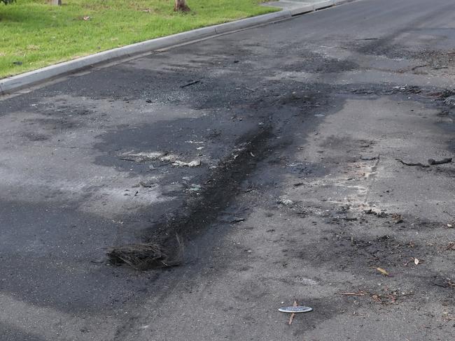 Burn marks on an Epping street where the carjacked car vehicle was found. Photo: NCA NewsWire / David Crosling