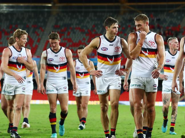 GOLD COAST, AUSTRALIA - JUNE 21: Crows leave the field after losing the round 3 AFL match between the Gold Coast Suns and the Adelaide Crows at Metricon Stadium on June 21, 2020 in Gold Coast, Australia. (Photo by Chris Hyde/Getty Images)