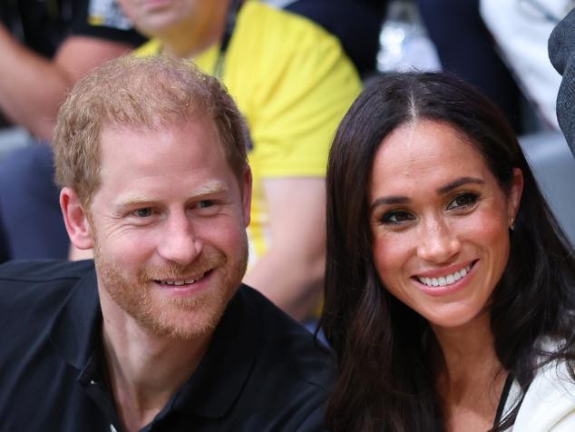 DUESSELDORF, GERMANY - SEPTEMBER 13: Prince Harry, Duke of Sussex and Meghan, Duchess of Sussex pose for a photograph as they attend the Wheelchair Basketball preliminary match between Ukraine and Australia during day four of the Invictus Games Düsseldorf 2023 on September 13, 2023 in Duesseldorf, Germany. (Photo by Chris Jackson/Getty Images for the Invictus Games Foundation)