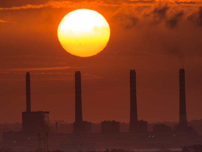 The sun sets over El Palito oil refinery in Puerto Cabello, Venezuela, on Monday, Aug. 24, 2015. Puerto Cabello is the entry point for government-subsidized meat from the Brazilian company JBS SA. Port officials say the subsidized food is channeled to state shops in areas most threatened by riots or government opposition campaigning. Photographer: Meridith Kohut/Bloomberg