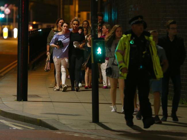 More members of the public are escorted from the Manchester Arena. Picture: Getty