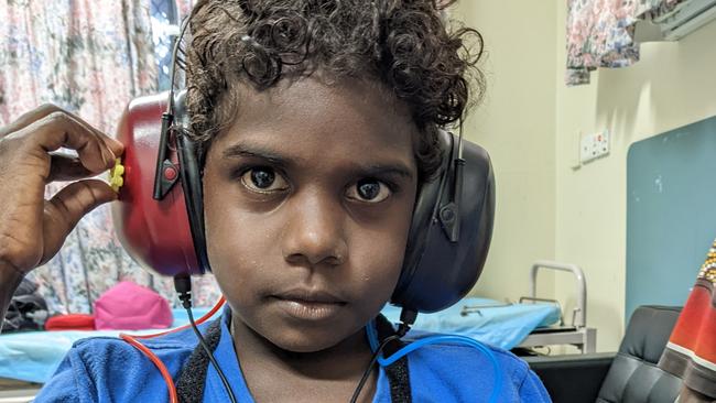 As part of the The Torres and Cape Hospital and Health Service Integrated Ear, Nose and Throat program, Kowanyama boy Naveen Accoom getting his ears tested by Dr Stephen Johnston Picture: Supplied