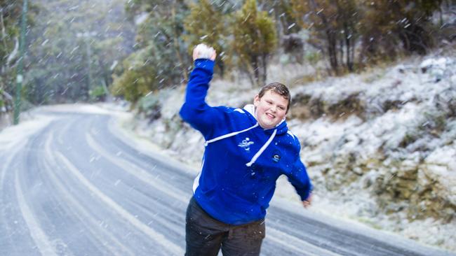 Riley Direen playing in the snow in Berriedale where roads became impassable on Tuesday afternoon. Picture: Richard Jupe