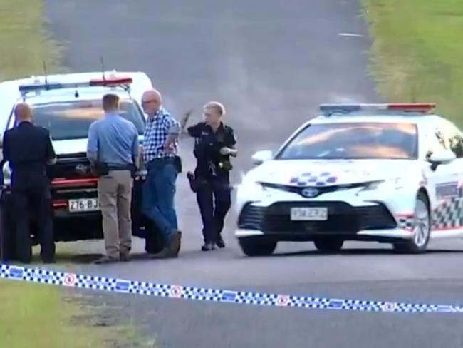 Police pictured at a Running Creek Road property near Kilkivan where a man was stabbed and police shot the other other person Picture 7News