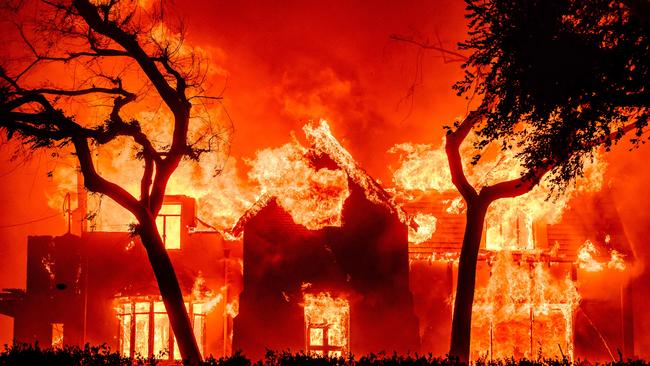 A home is engulfed in flames during the Eaton fire in the Altadena area of Los Angeles County, California on January 8, 2025. Photo by JOSH EDELSON / AFP