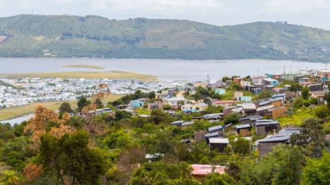 An “informal settlement” overlooks million dollar waterfront properties in Knysna, South Africa.