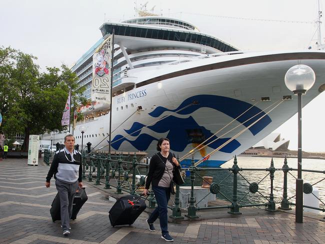 Passengers disembark from the Ruby Princess at the Overseas Passenger Terminal. Picture: Getty