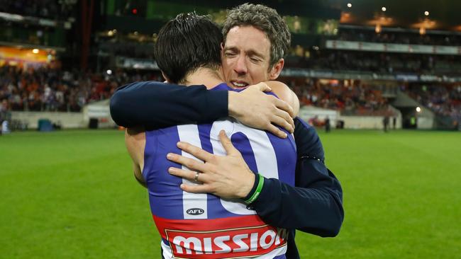 Bob Murphy hugs Easton Wood after the preliminary final.