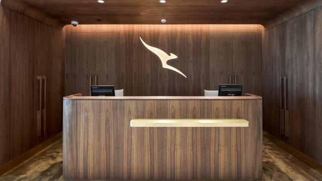 The distinctive wood-panelled entry to Qantas Chairman’s Lounge. Picture: Lucas Muro