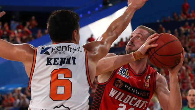 PERTH, AUSTRALIA — DECEMBER 09: Jesse Wagstaff of the Wildcats looks to put a shot up against Jarrod Kenny of the Taipans during the round eight NBL match between the Perth Wildcats and the Cairns Taipans at RAC Arena on December 09, 2018 in Perth, Australia. (Photo by Paul Kane/Getty Images)