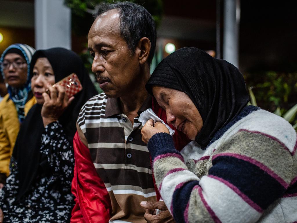 Devastated family members grieve as they wait for news at a crisis centre at Soekarno-Hatta airport. Picture: Getty