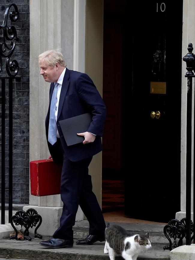 Britain's Prime Minister Boris Johnson leaves from 10 Downing Street to make a statement to MPs in the House of Commons following the publication of the Gray report.