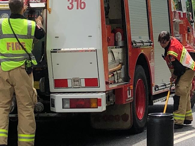 Fire and Rescue Lismore firefighters clean up a diesel spill on the Bruxner Hwy. File Photo: Alison Paterson