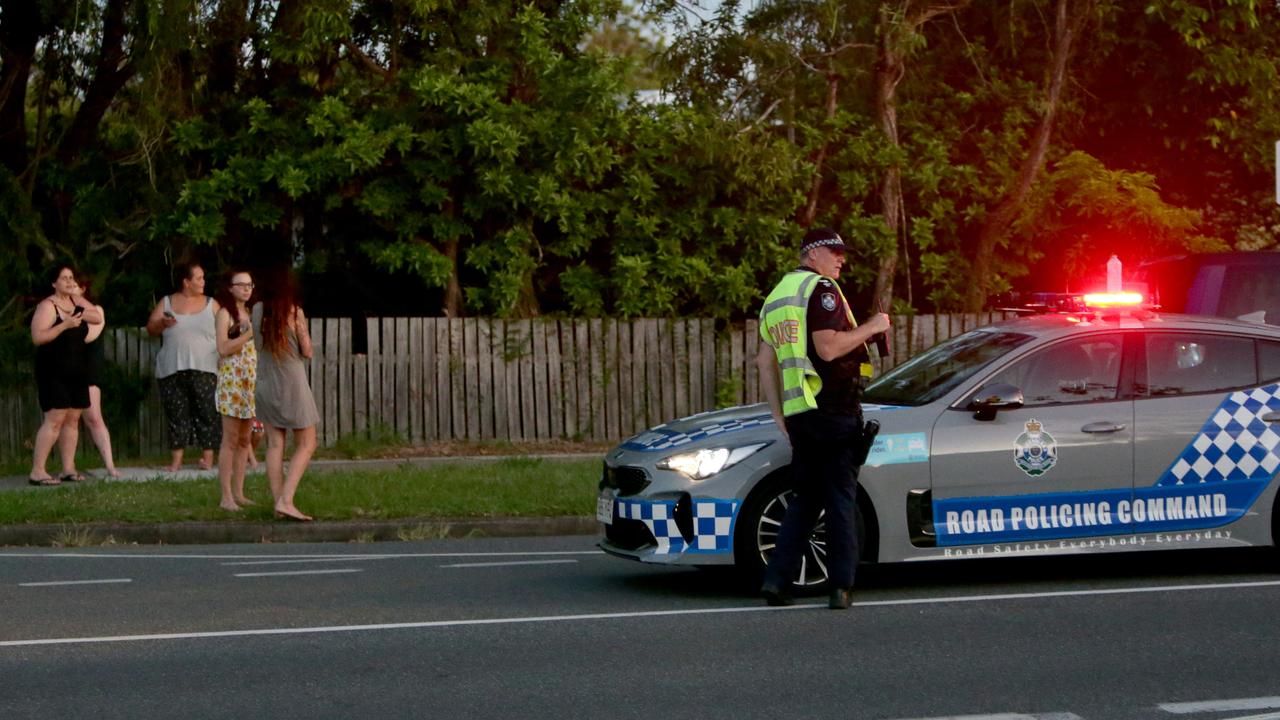 Police and onlookers at the scene of the Alexandra Hills double fatality. Picture: Steve Pohlner