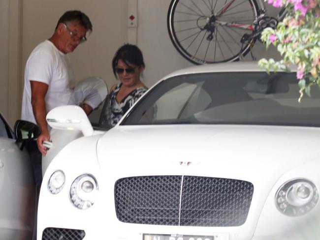 Lisa Ho and Nick Jacenko with the new Bentley in Double Bay.